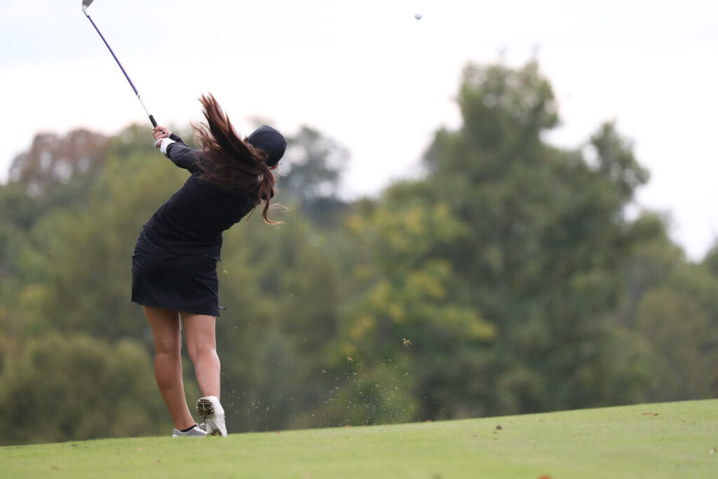 Golfer that just took her swing