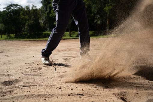 Hitting out of sand bunker golf skills