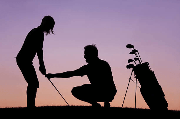 Practice golf fundamentals with a a coach